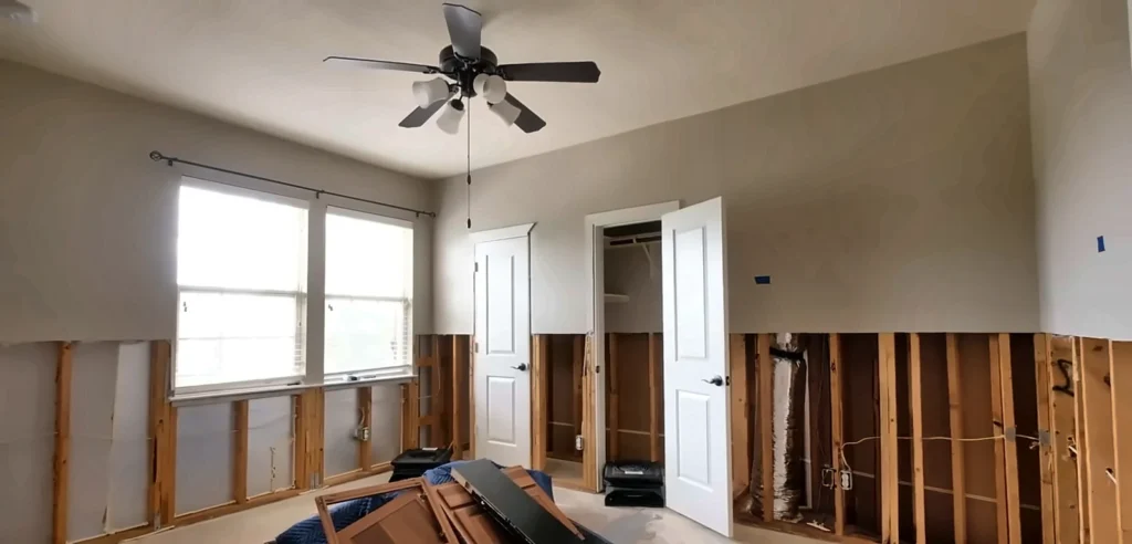 Bonita Springs water damage restoration: flood cut drywall in a bedroom after river flooding