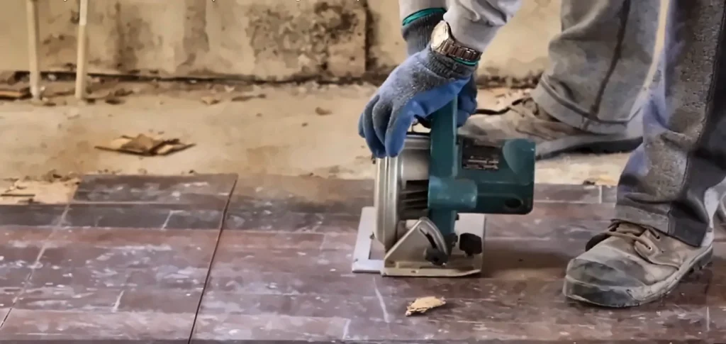 Burst pipe cleanup service Fort Myers: cutting out damaged tile to reach a slab leak