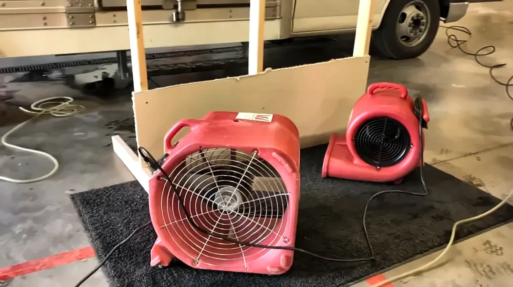 Estero water damage restoration: air movers drying materials in an Estero condo